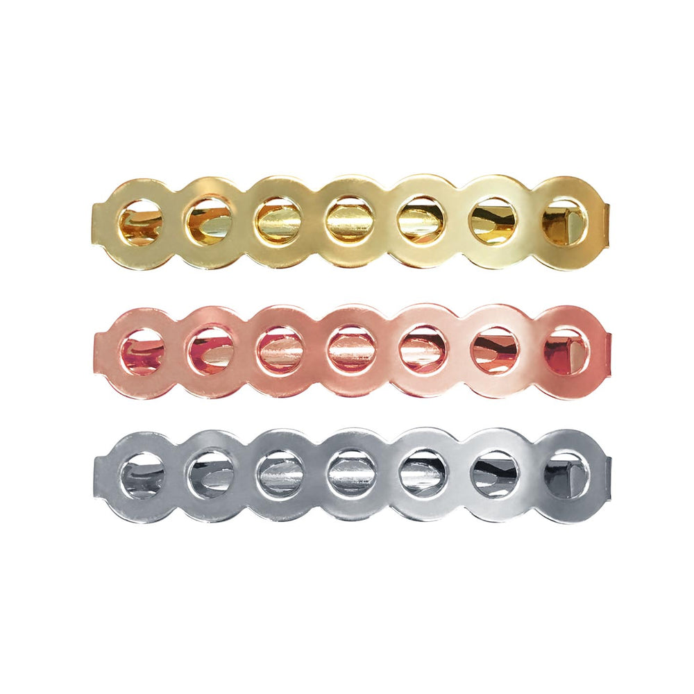 Image of three barrettes that have a row of circles for each barrette in gold, rose gold & silver on a white background