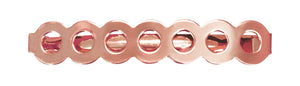 Image of a barrette that has a row of circles  in rose gold on a white background