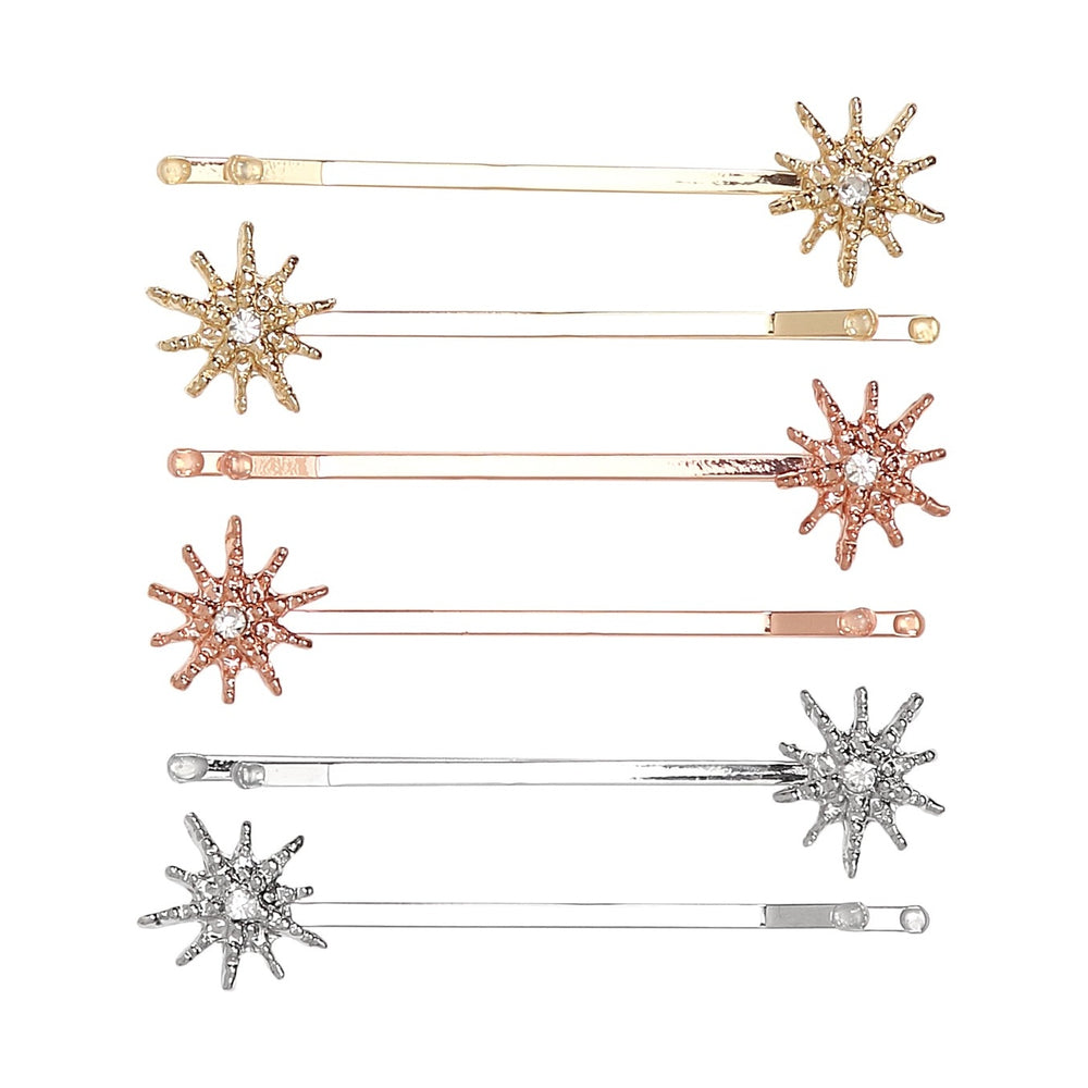 Image of 6 bobby pins that have a small snowflake shape at the end of the bobby pin with a faux crystal. 2 of each metallic color: gold, rose gold & silver.
