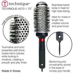 Hair styling brush with round bristle head and black handle on a white background