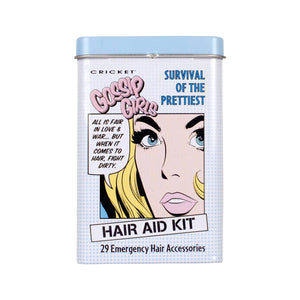A rectangular metal tin for the Cricket Gossip Girl Hair Aid Kit, featuring a pop-art illustration of a woman's face with blonde hair, blue eyes, and pink lips on a white background with a light blue grid pattern.