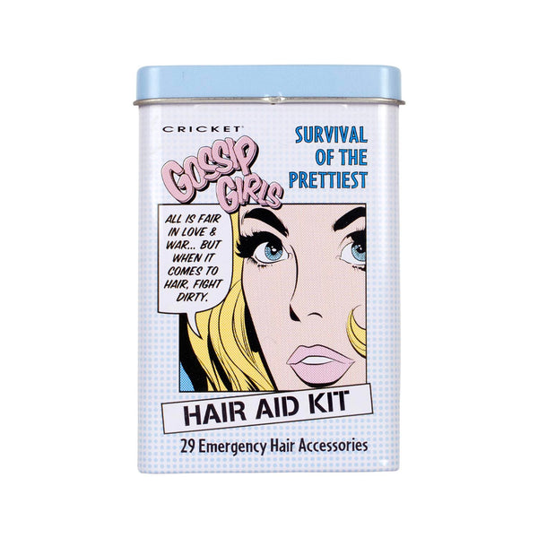 A rectangular metal tin for the Cricket Gossip Girl Hair Aid Kit, featuring a pop-art illustration of a woman's face with blonde hair, blue eyes, and pink lips on a white background with a light blue grid pattern.