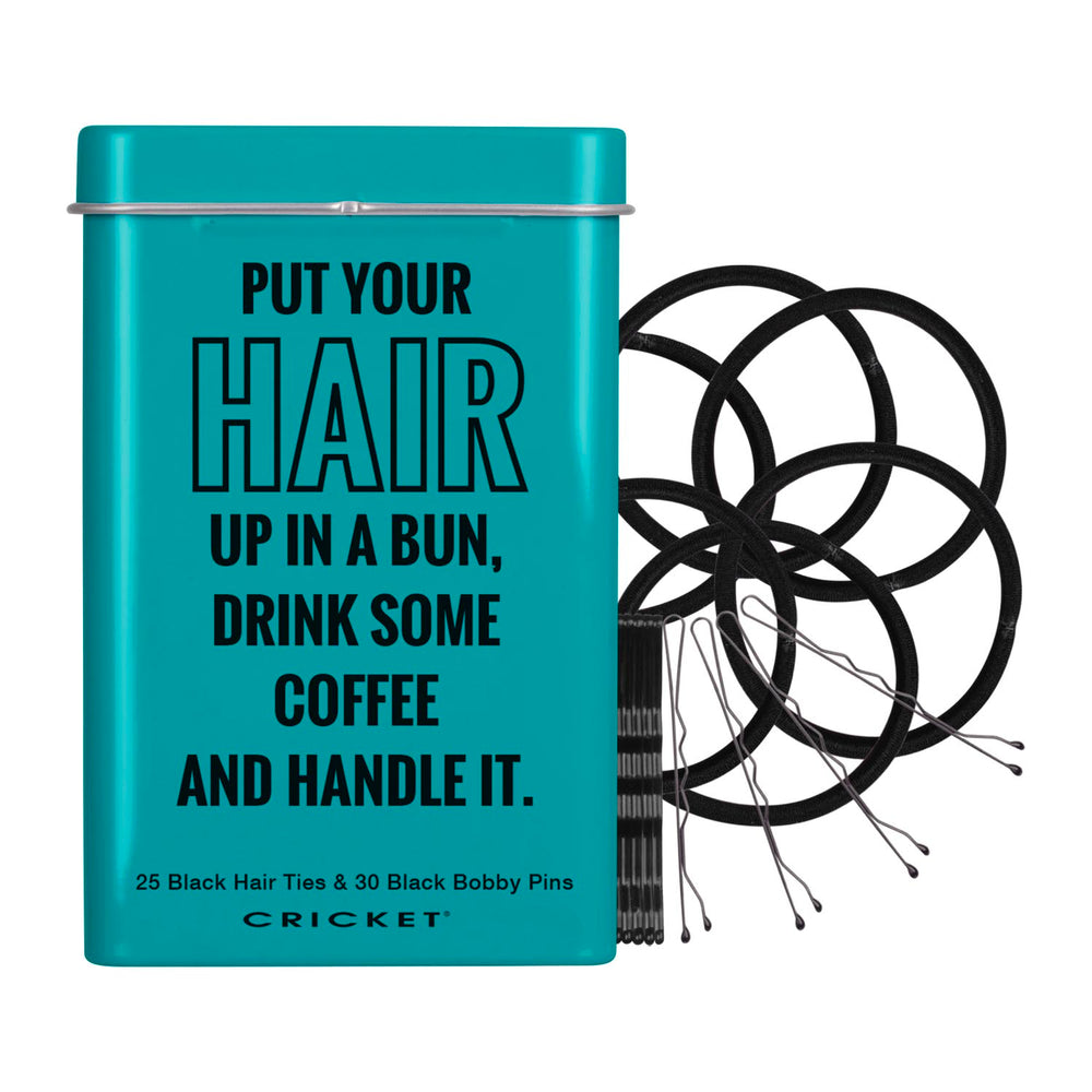 A teal metal tin with a lid and black text that reads, 'PUT YOUR HAIR UP IN A BUN, DRINK SOME COFFEE AND HANDLE IT.' Small text at the bottom says '25 Black Hair Ties & 30 Black Bobby Pins' and the brand 'CRICKET' appears below.
