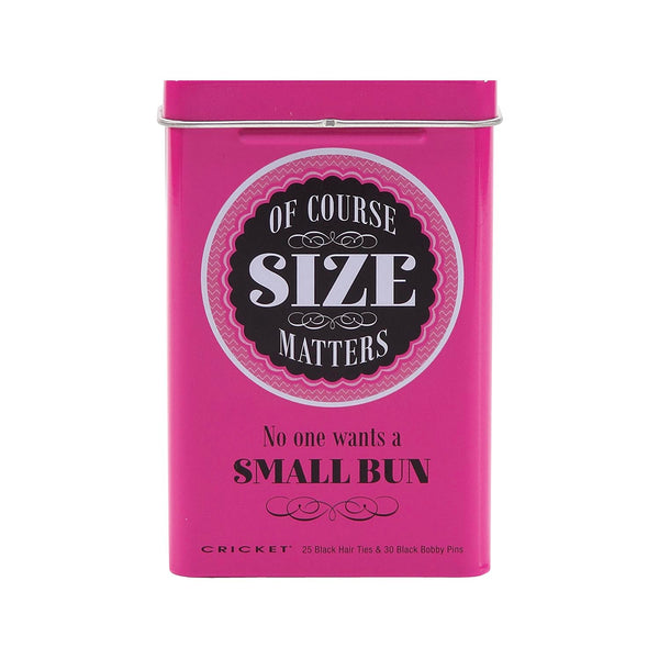 A bright pink rectangular metal tin with a hinged lid, featuring the text 'OF COURSE SIZE MATTERS' in a circular black-and-white label and 'No one wants a SMALL BUN' below it. Small text at the bottom reads 'CRICKET 25 Black Hair Ties & 30 Black Bobby Pins'.