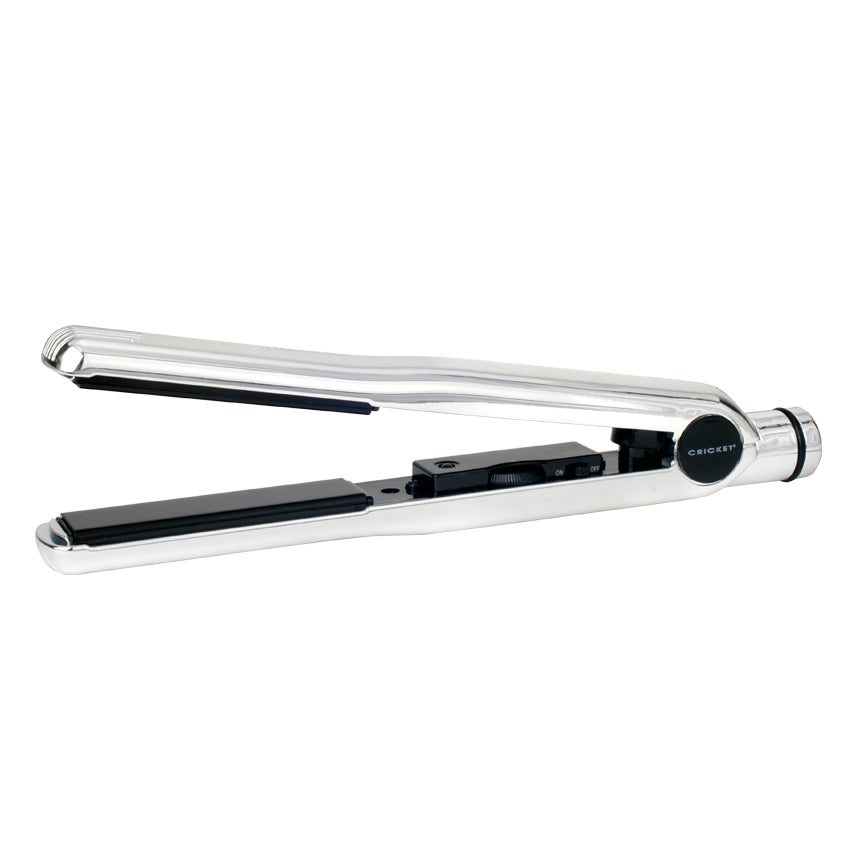 Chrome hair straightener styling iron on a white background