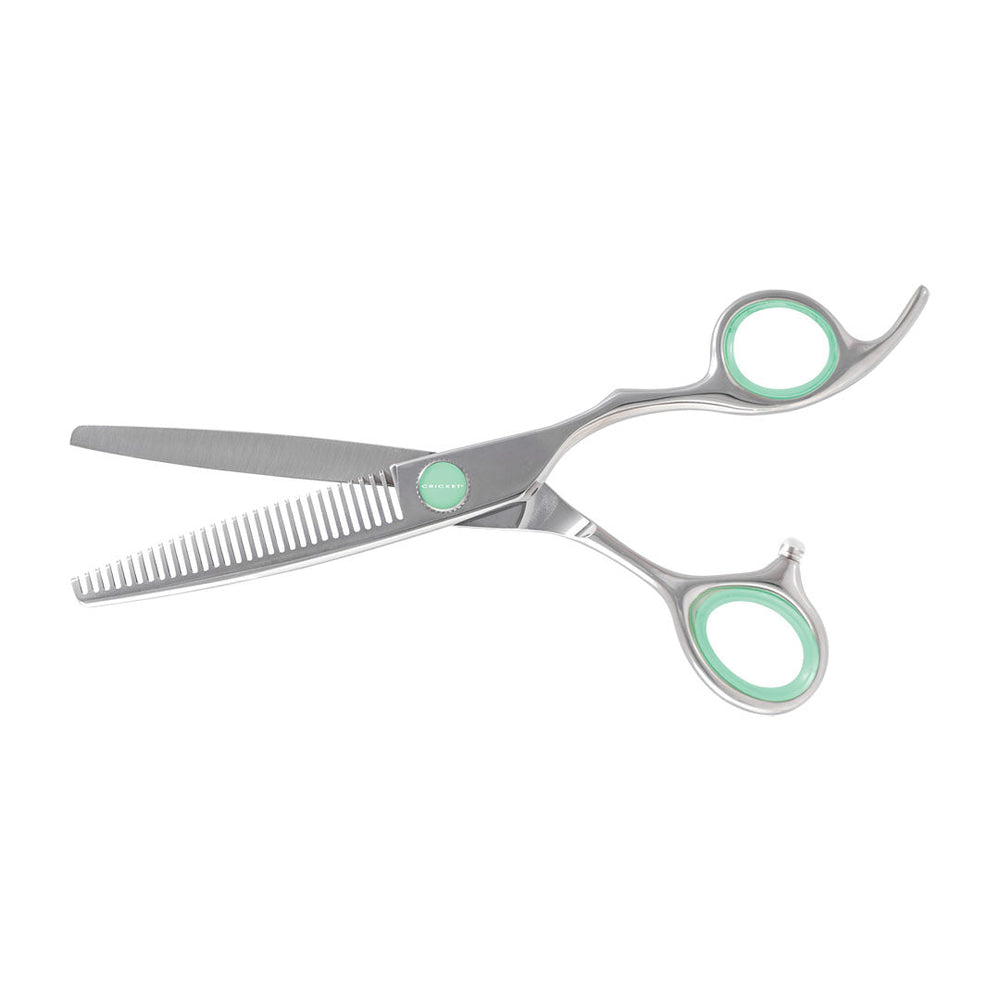 Metallic silver hairdressing scissors with mint green accents on the handles and a matching mint green logo button, shown on a plain white background.