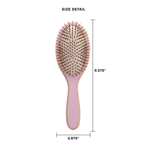 Pink hairbrush with measurements on a white background